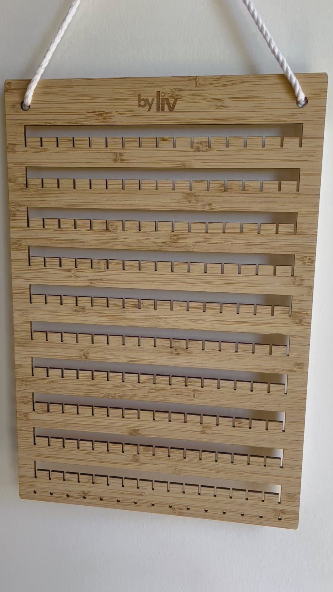 Video showing how easy it is to put your earring collection onto a By Liv Earring Board
